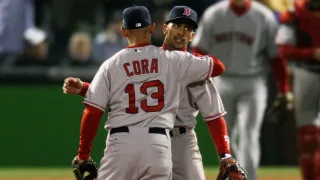 DENVER – OCTOBER 27: Alex Cora #13 and Julio Lugo #23 of the Boston Red Sox celebrate after their 10-5 win against the Colorado Rockies during Game Three of the 2007 Major League Baseball World Series at Coors Field on October 27, 2007 in Denver, Colorado. (Photo by Jed Jacobsohn/Getty Images)