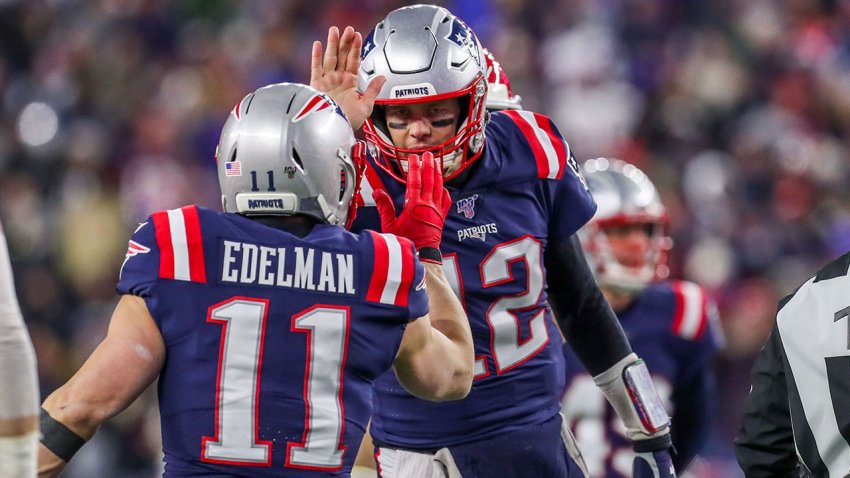 Dec 8, 2019; Foxborough, MA, USA; New England Patriots quarterback Tom Brady (12) and New England Patriots receiver Julian Edelman (11) celebrate after a touchdown during the first half against the Kansas City Chiefs at Gillette Stadium. Mandatory Credit: Paul Rutherford-USA TODAY Sports