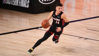 Sep 19, 2020; Lake Buena Vista, Florida, USA; Miami Heat guard Tyler Herro (14) brings the ball up court against the Boston Celtics during the first half of game three of the Eastern Conference Finals of the 2020 NBA Playoffs at ESPN Wide World of Sports Complex. Mandatory Credit: Kim Klement-USA TODAY Sports