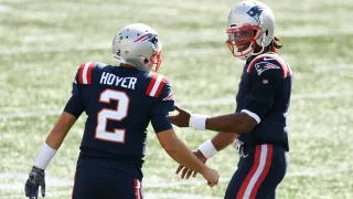Sep 13, 2020; Foxborough, Massachusetts, USA; New England Patriots quarterback Cam Newton (1) talks with quarterback Brian Hoyer (2) during a timeout in the second half of a game against the Miami Dolphins at Gillette Stadium. Mandatory Credit: Brian Fluharty-USA TODAY Sports