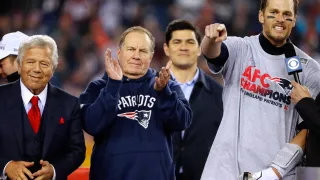 Jan 22, 2017; Foxborough, MA, USA; New England Patriots quarterback Tom Brady (12) points to teammates as head coach Bill Belichick and owner Robert Kraft look on after the 2017 AFC Championship Game against the Pittsburgh Steelers at Gillette Stadium. Mandatory Credit: Winslow Townson-USA TODAY Sports