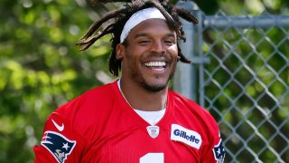 New England Patriots quarterback Cam Newton walks to the field for an NFL football training camp practice, Friday, Aug. 21, 2020, in Foxborough, Mass. (AP Photo/Michael Dwyer, Pool)
