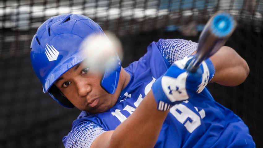 BRADENTON, FL – JANUARY 29: D’Angelo Ortiz drills the ball during IMG Academy batting practice in Bradenton, FL on Jan. 29, 2020. Big papi David Ortiz’s son is now a strapping 6-foot-1-inch, 225-pound third baseman who has adopted the batting stance of his famous father and will don his No. 34 when the season starts. He wears a Red Sox Nation and a Believe wristband and is sporting a gold necklace that he borrowed from his father. (Photo by Stan Grossfeld/The Boston Globe via Getty Images)