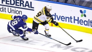 TORONTO, ONTARIO – AUGUST 23: David Pastrnak #88 of the Boston Bruins is defended by Ondrej Palat #18 of the Tampa Bay Lightning during the first period in Game One of the Eastern Conference Second Round during the 2020 NHL Stanley Cup Playoffs at Scotiabank Arena on August 23, 2020 in Toronto, Ontario. (Photo by Elsa/Getty Images)
