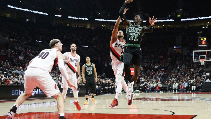 Dec 4, 2021; Portland, Oregon, USA; Boston Celtics guard Dennis Schroder (71) shoots a basket against Portland Trail Blazers guard CJ McCollum (3) during the first half at Moda Center. Mandatory Credit: Troy Wayrynen-USA TODAY Sports