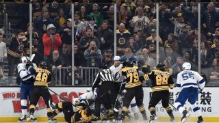 Mar 7, 2020; Boston, Massachusetts, USA; The Boston Bruins and Tampa Bay Lightning mix it up after the whistle during the second period at TD Garden. Mandatory Credit: Bob DeChiara-USA TODAY Sports