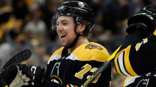 May 12, 2019; Boston, MA, USA; Boston Bruins defenseman Charlie McAvoy (73) smiles at teammates after their 6-2 win over the Carolina Hurricanes in game two of the Eastern Conference Final of the 2019 Stanley Cup Playoffs at TD Garden. Mandatory Credit: Winslow Townson-USA TODAY Sports