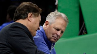 Boston Celtics owner Steve Pagliuca, left, shows something on his cellphone to Celtics President of Basketball Operations Danny Ainge during a break in the first quarter of an NBA basketball game against the Toronto Raptors, Friday, Nov. 16, 2018, in Boston. (AP Photo/Elise Amendola)