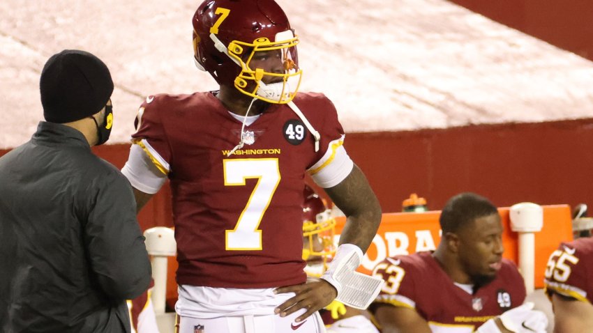 Dec 27, 2020; Landover, Maryland, USA; Washington Football Team quarterback Dwayne Haskins (7) stands on the sidelines after being benched against the Carolina Panthers in the fourth quarter at FedExField. Mandatory Credit: Geoff Burke-USA TODAY Sports
