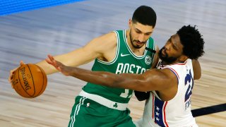 Aug 19, 2020; Lake Buena Vista, Florida, USA; Joel Embiid #21 of the Philadelphia 76ers reaches for a steal against Enes Kanter #11 of the Boston Celtics during the third quarter in game two of the first round of the 2020 NBA Playoffs at The Field House. Mandatory Credit: Kevin C. Cox/Pool Photo-USA TODAY Sports