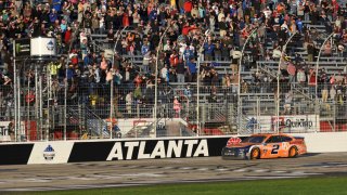 Feb 24, 2019; Hampton, GA, USA; Monster Energy NASCAR Cup Series driver Brad Keselowski (2) crosses the finish line to win the Folds of Honor QuickTrip 500 at Atlanta Motor Speedway. Mandatory Credit: Adam Hagy-USA TODAY Sports