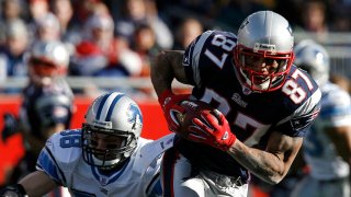 New England Patriots receiver Reche Caldwell (87) tries to avoid the tackle of Detroit Lions safety Jon McGraw during the Patriots 28-21 win in a NFL game at Gillette Stadium in Foxborough, Mass. on Sunday, Dec. 3, 2006. Caldwell had 8 receptions for 112 yards in the win. (AP Photo/Winslow Townson)