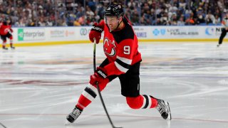 Oct 5, 2019; Buffalo, NY, USA; New Jersey Devils left wing Taylor Hall (9) takes a shot on goal against the Buffalo Sabres at KeyBank Center. Mandatory Credit: Timothy T. Ludwig-USA TODAY Sports