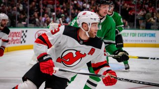 Dec 10, 2019; Dallas, TX, USA; New Jersey Devils left wing Taylor Hall (9) and Dallas Stars defenseman Miro Heiskanen (4) chase the puck during the first period at the American Airlines Center. Mandatory Credit: Jerome Miron-USA TODAY Sports