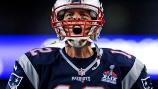 FILE – In this Sept. 10, 2015 file photo, New England Patriots quarterback Tom Brady yells as he takes the field before the first game of the season against the Pittsburgh Steelers in Foxborough, Mass. The photo was part of a series of images by photographer Charles Krupa which won the Thomas V. diLustro best portfolio award for 2015 given out by the Associated Press Sports Editors during their annual winter meeting in St. Petersburg, Fla. (AP Photo/Charles Krupa, File)