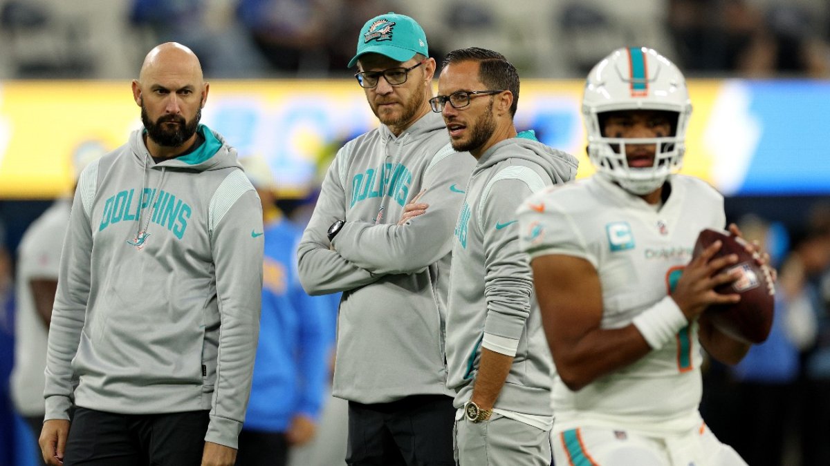 Miami Dolphins quarterback Tua Tagovailoa (1) sits on the bench on the  sidelines as the Dolphin …