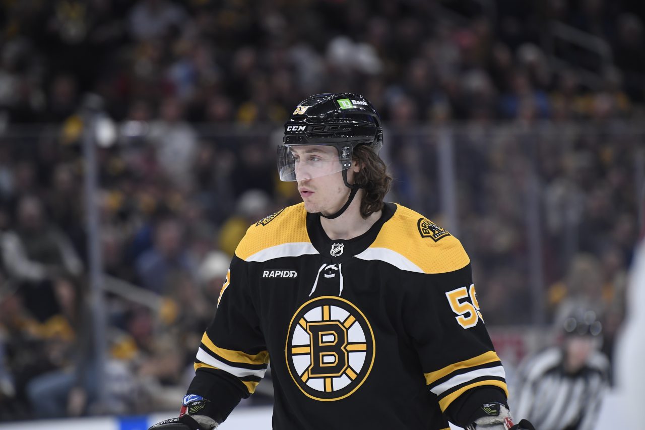 Milan Lucic of the Boston Bruins wears a camo jersey in the hallway News  Photo - Getty Images