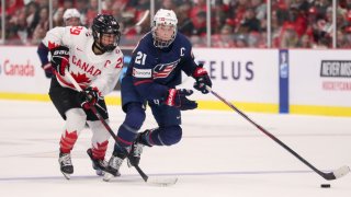 Forward Marie-Philip Poulin of Canada skates against forward Hilary Knight of USA during the gold medal game of the 2023 IIHF Women&#8217;s World Championship at CAA Centre on April 16, 2023 in Brampton, Ontario.