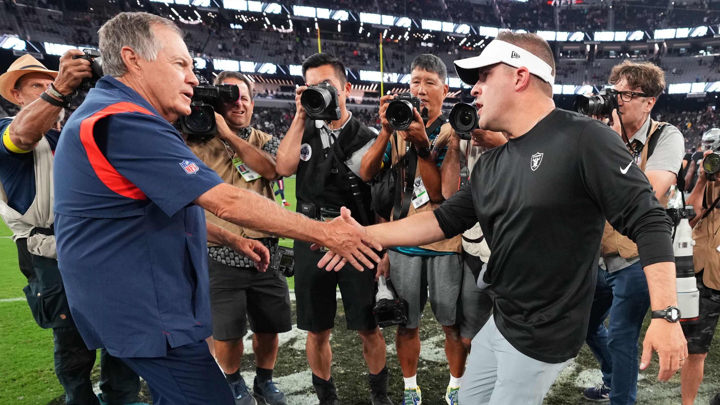 Head coach Jimmy Johnson of the Dallas Cowboys watches pregame News  Photo - Getty Images