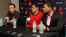 Red Sox General Manager Ben Cherington, international scouting director Eddie Romero and newly signed Yoan Moncada