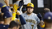 Aug 11, 2023; Chicago, Illinois, USA; Milwaukee Brewers catcher Victor Caratini (7) celebrates with teammates after scoring against the Chicago White Sox during the second inning at Guaranteed Rate Field. Mandatory Credit: Kamil Krzaczynski-USA TODAY Sports