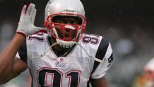 Dec 14, 2008; Oakland, CA, USA; New England Patriots wide receiver Randy Moss (81) taunts the crowd during the first quarter against the Oakland Raiders at Oakland-Alameda County Coliseum. Mandatory Credit: Phil Carter-USA TODAY Sports