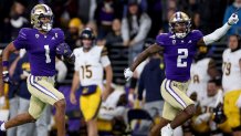 SEATTLE, WASHINGTON - SEPTEMBER 23: Rome Odunze #1 of the Washington Huskies celebrates his touchdown with Ja'Lynn Polk #2 during the first quarter against the California Golden Bears at Husky Stadium on September 23, 2023 in Seattle, Washington. (Photo by Steph Chambers/Getty Images)