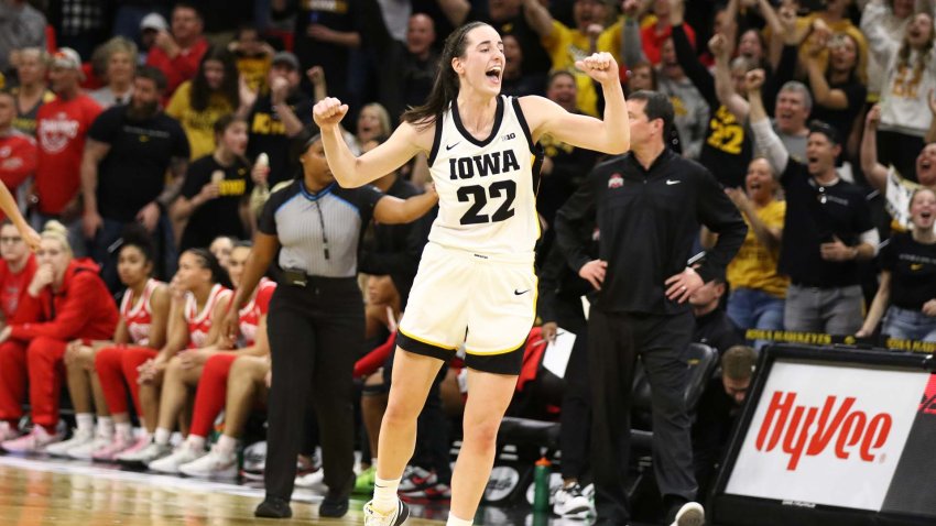IOWA CITY, IOWA- MARCH 3:  Guard Caitlin Clark #22 of the Iowa Hawkeyes celebrates after breaking Pete Maravich’s all-time NCAA scoring record during the first half against the Ohio State Buckeyes at Carver-Hawkeye Arena on March 3, 2024 in Iowa City, Iowa.  (Photo by Matthew Holst/Getty Images)