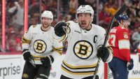 Watch Bruins' Brad Marchand lay out Matthew Tkachuk with huge hit