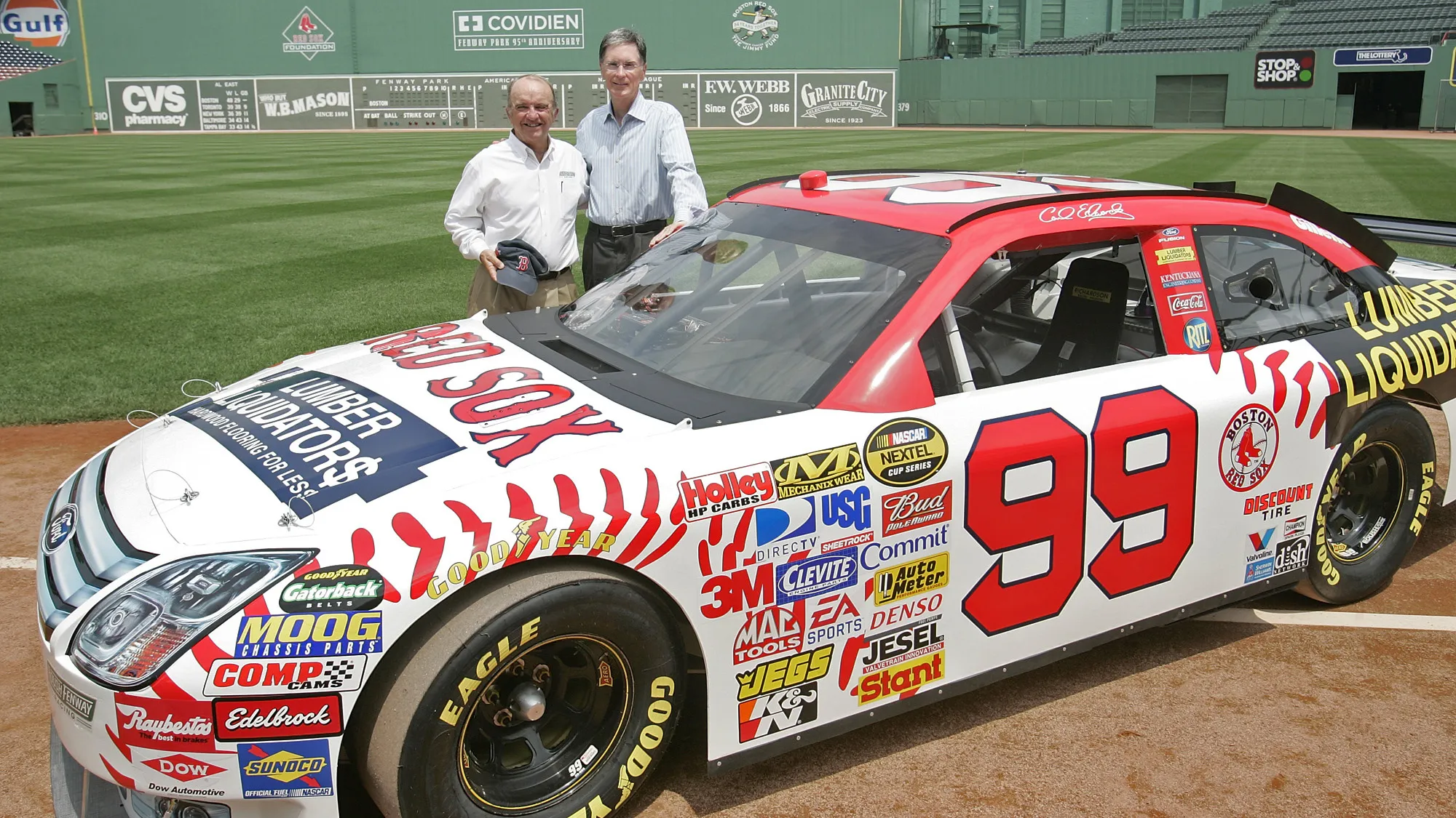 John Henry poses with Jack Roush and the No. 99 Red Sox car