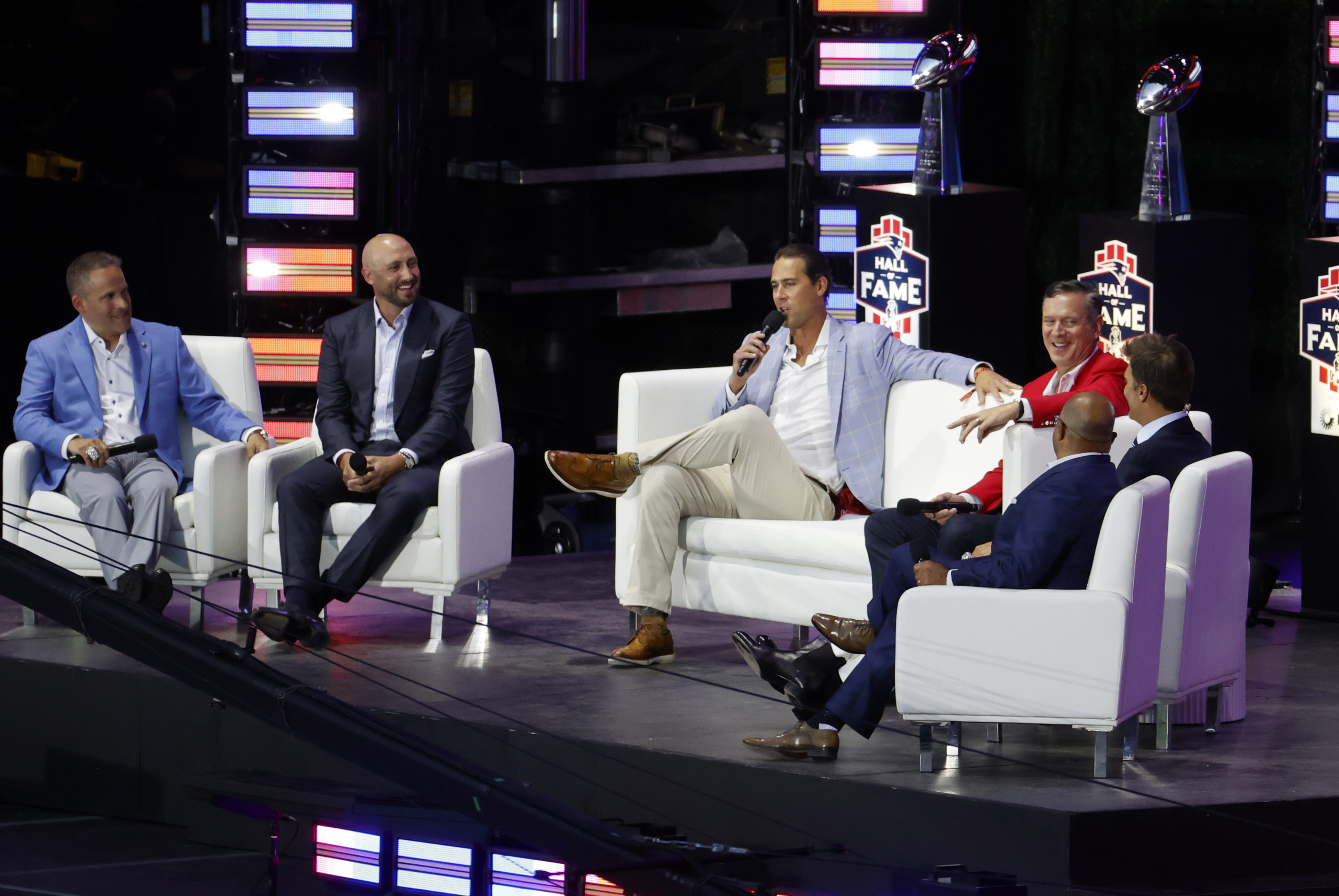 The quarterback room: Josh McDaniels, Brian Hoyer, Matt Cassel, Drew Bledsoe and Tom Brady during the induction of Tom Brady into the New England Patriots Hall of Fame on June 12, 2024 at Gillette Stadium in Foxborough, Massachusetts.