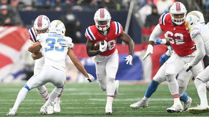 Dec 3, 2023; Foxborough, Massachusetts, USA; New England Patriots running back Rhamondre Stevenson (38) rushes against the Los Angeles Chargers during the first half at Gillette Stadium. Mandatory Credit: Brian Fluharty-USA TODAY Sports