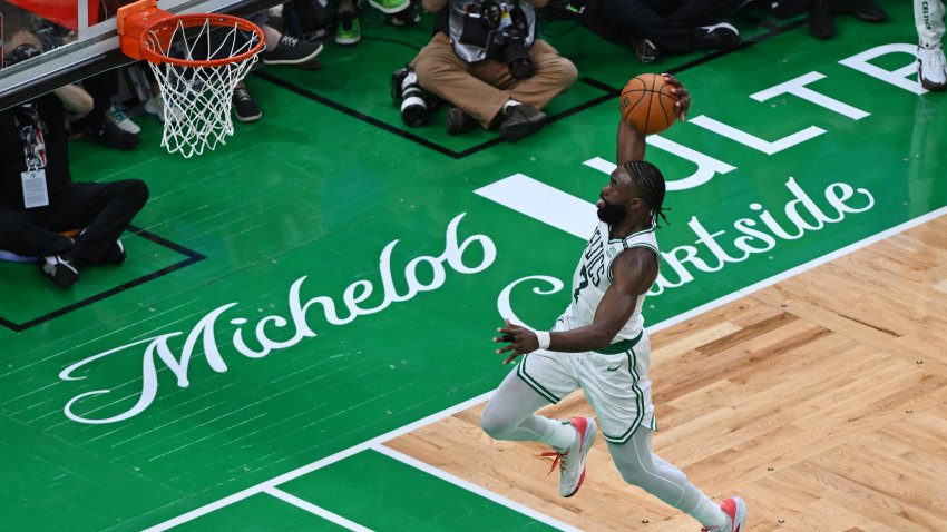 Jun 6, 2024; Boston, Massachusetts, USA; Boston Celtics guard Jaylen Brown (7) dunks the ball against the Dallas Mavericks during the second quarter of game one of the 2024 NBA Finals at TD Garden. Mandatory Credit: Peter Casey-USA TODAY Sports