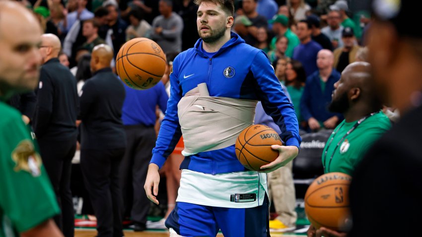 Jun 9, 2024; Boston, Massachusetts, USA; Dallas Mavericks guard Luka Doncic (77) wears a wrap around his chest while warming up before game two of the 2024 NBA Finals between the Boston Celtics and the Dallas Mavericks at TD Garden. Mandatory Credit: Peter Casey-USA TODAY Sports