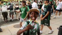 Celtics fans on the championship parade route in Boston before the duck boats came through on Friday, June 21, 2024.