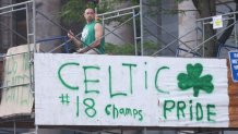 A sign on scaffolding in Boston for the Celtics' championship parade that reads "CELTIC βοΈ #18 Champs PRIDE"