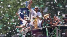 Jayson Tatum celebrates with the Larry O'Brien Championship Trophy during the Boston Celtics championship parade on Friday, June 21, 2024.
