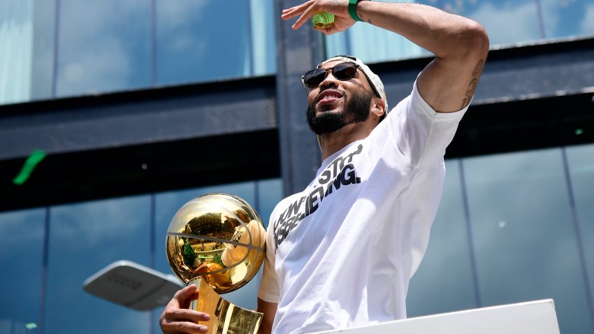 Jun 21, 2024; Boston, MA, USA;  Boston Celtics player Jayson Tatum on a duck boat during the Boston Celtics championship parade. Mandatory Credit: Bob DeChiara-USA TODAY Sports