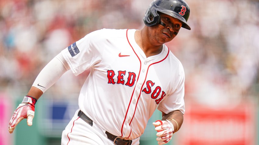 Jun 30, 2024; Boston, Massachusetts, USA; Boston Red Sox third baseman Rafael Devers (11) hits a two run home run against the San Diego Padres in the first inning at Fenway Park. Mandatory Credit: David Butler II-USA TODAY Sports