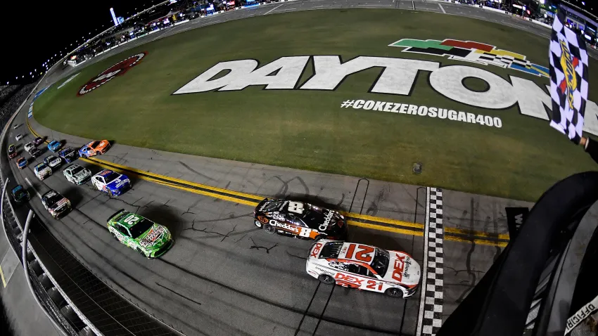 Harrison Burton, driver of the No. 21 DEX Imaging Ford, takes the checkered flag to win the Coke Zero Sugar 400