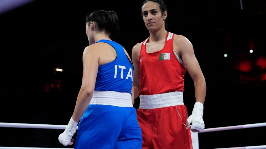 Algeria’s Imane Khelif, right, walks beside Italy’s Angela Carini after their women’s 66kg preliminary boxing match at the 2024 Summer Olympics, Thursday, Aug. 1, 2024, in Paris, France. (AP Photo/John Locher)