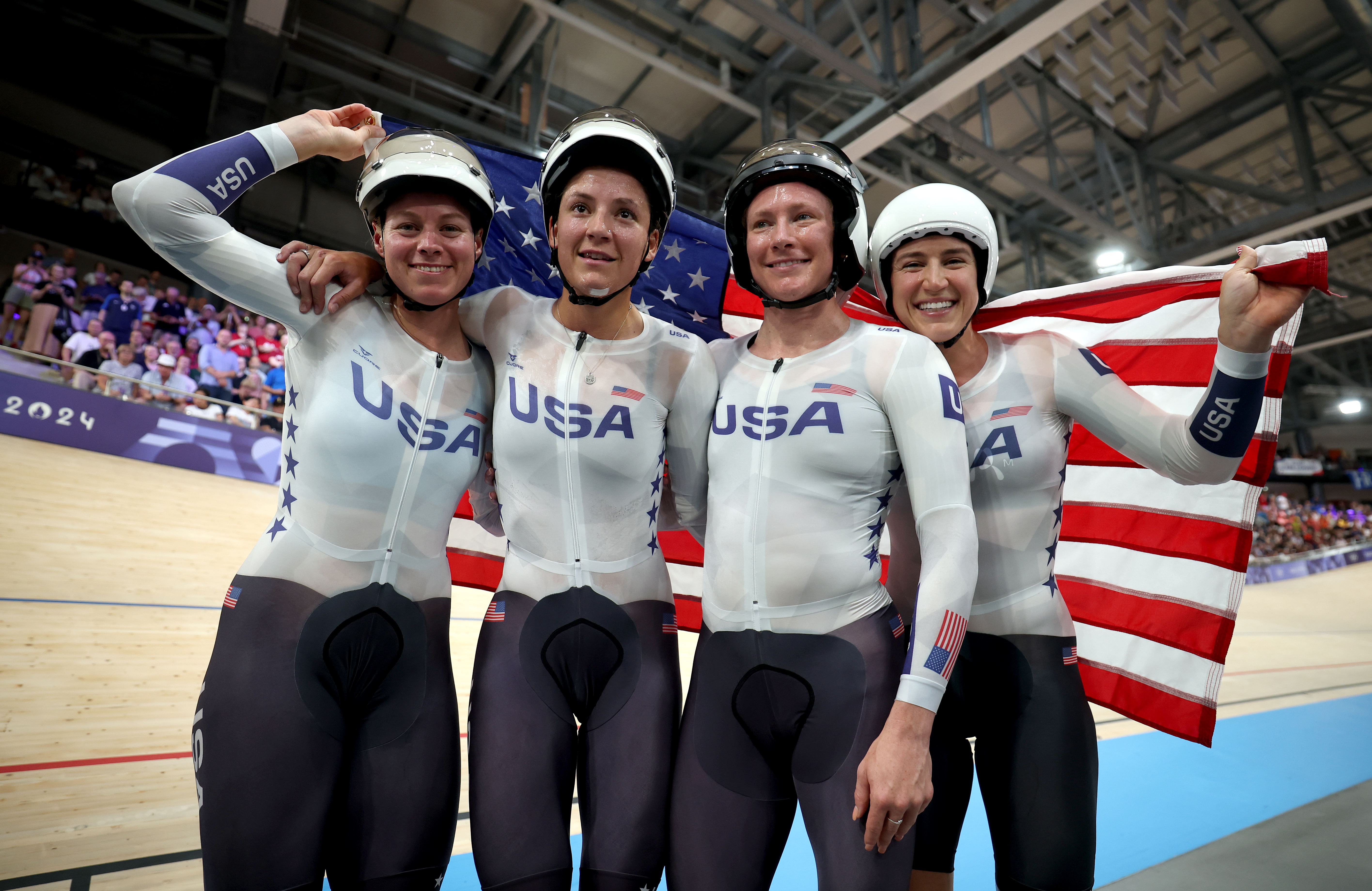 Gold medalists Jennifer Valente, Lily Williams, Chloe Dygert and Kristen Faulkner of Team USA celebrate after the women's team pursuit finals at Saint-Quentin-en-Yvelines Velodrome in Paris on Wednesday, Aug. 7, 2024, Day 12 of the 2024 Olympic Games.