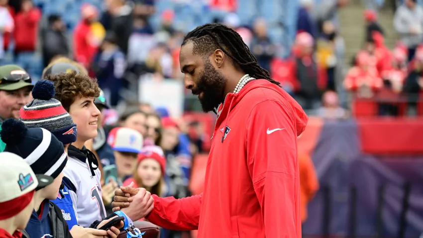 Dec 17, 2023; Foxborough, Massachusetts, USA; New England Patriots linebacker Matthew Judon (9) greets fans before a game against the Kansas City Chiefs at Gillette Stadium. Mandatory Credit: Eric Canha-USA TODAY Sports