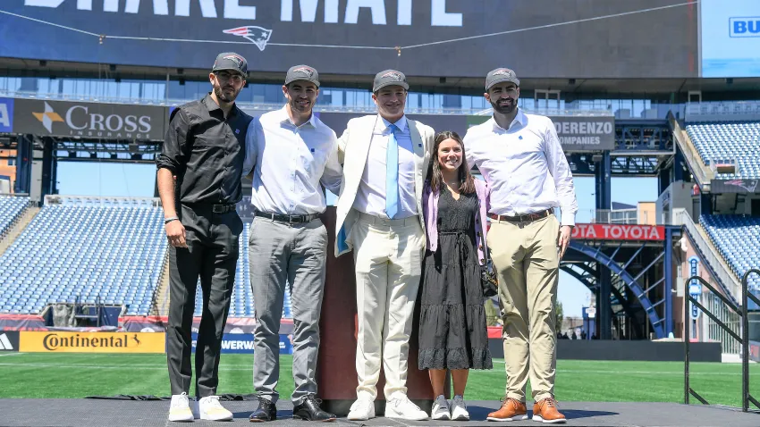 Apr 26, 2024; Foxborough, MA, USA; New England Patriots number one draft pick quarterback Drake Maye (C) introduces (L-R: Beau, Cole, Luke) and his girlfriend since 7th grade (Ann Michael) on the game field at Gillette Stadium. Mandatory Credit: Eric Canha-USA TODAY Sports