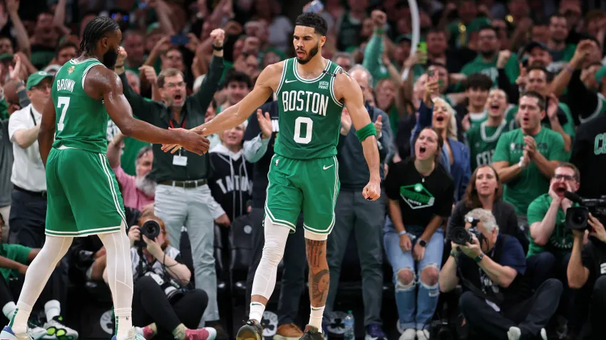 Jun 17, 2024; Boston, Massachusetts, USA; Boston Celtics forward Jayson Tatum (0) celebrates with guard Jaylen Brown (7) after a play against the Dallas Mavericks during the second quarter in game five of the 2024 NBA Finals at TD Garden. Mandatory Credit: Peter Casey-USA TODAY Sports