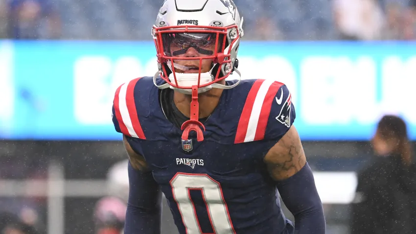 August 8, 2024; Foxborough, MA, USA;  New England Patriots cornerback Christian Gonzalez (0) warms up before a game against the Carolina Panthers at Gillette Stadium. Mandatory Credit: Eric Canha-USA TODAY Sports