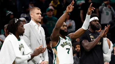 Celtics teammates Jrue Holiday, Kristaps Porzingis, Jaylen Brown and Neemias Queta