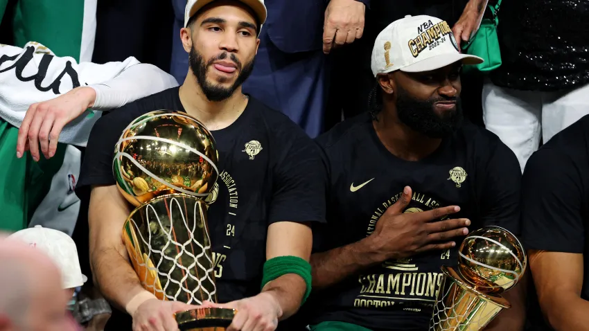 Jun 17, 2024; Boston, Massachusetts, USA; Boston Celtics forward Jayson Tatum (0) and guard Jaylen Brown (7) celebrates with the Larry O’Brian Trophy after beating the Dallas Mavericks in game five of the 2024 NBA Finals to win the NBA Championship at TD Garden. Mandatory Credit: Peter Casey-USA TODAY Sports