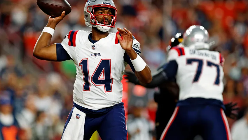 Aug 25, 2024; Landover, Maryland, USA; New England Patriots quarterback Jacoby Brissett (14) throws a pass during the first quarter against the Washington Commanders during a preseason game at Commanders Field. Mandatory Credit: Peter Casey-USA TODAY Sports