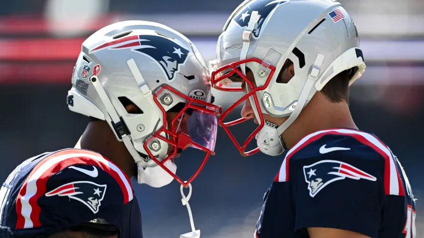 Sep 15, 2024; Foxborough, Massachusetts, USA; New England Patriots quarterback Drake Maye (10) and wide receiver Ja’Lynn Polk (1) talk before a game against the Seattle Seahawks at Gillette Stadium. Mandatory Credit: Brian Fluharty-Imagn Images